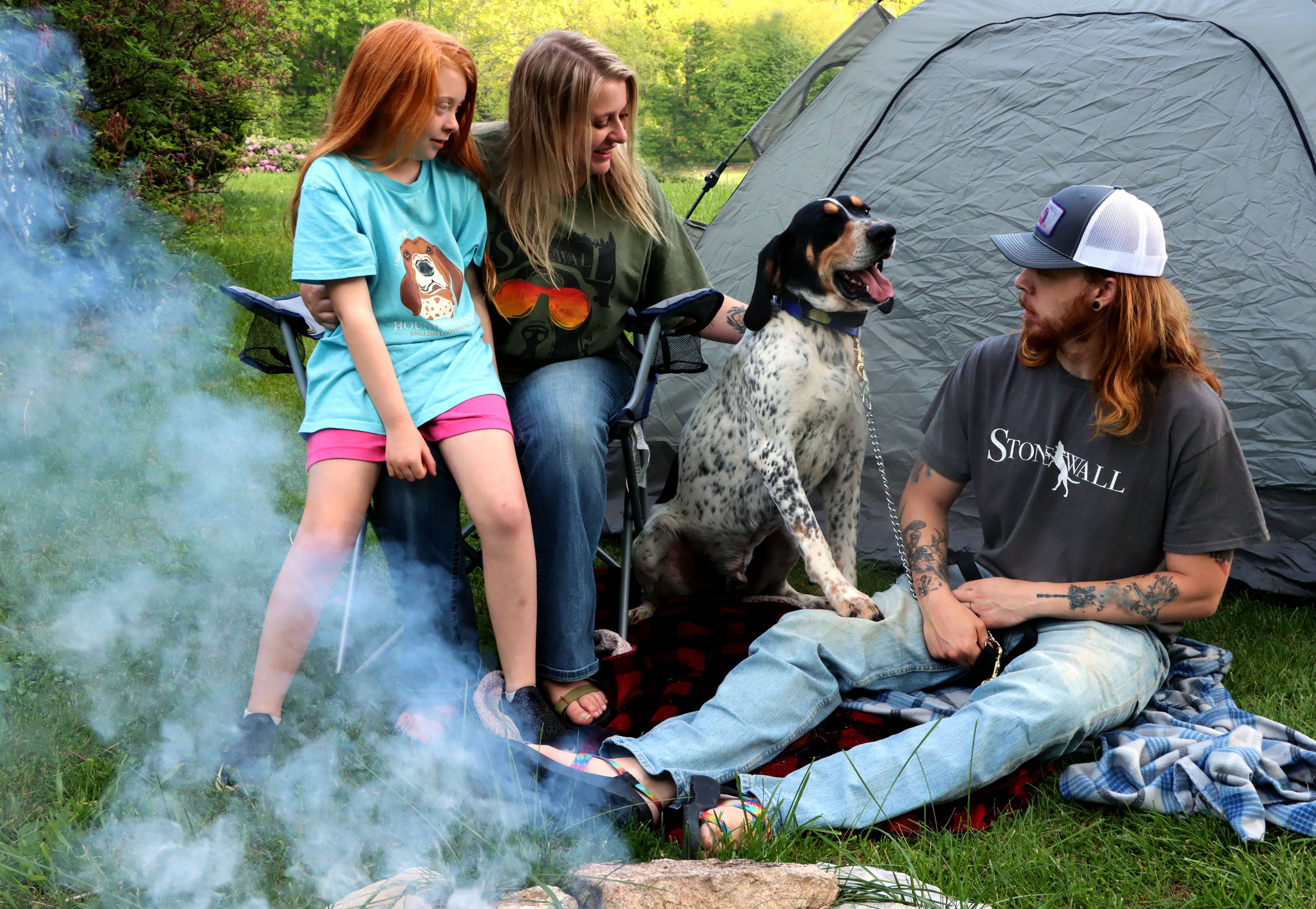 Family camping with hound