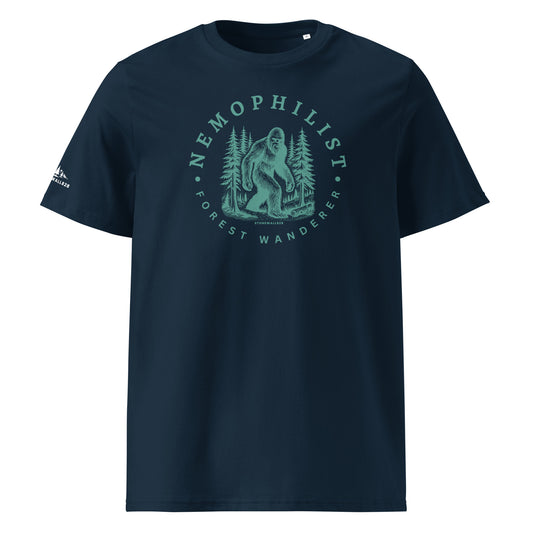 Product mockup. Inspired by the quiet-hearted and the forest-minded, this heritage graphic tee features Bigfoot moving through the pines with the easy confidence of something born from the ridgelines.